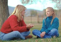 Picture of a woman talking to an adolescent girl